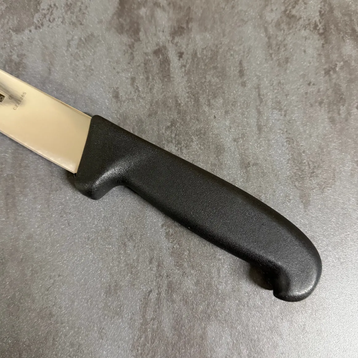 coltello_sezionare_cm__ma_2-1.webp COLTELLO SEZIONARE 26CM - MAGLIONERO -